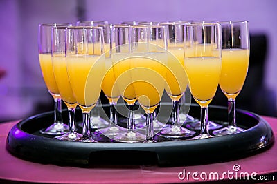 Closeup of a tray of orange flavored welcome drinks at an event Stock Photo