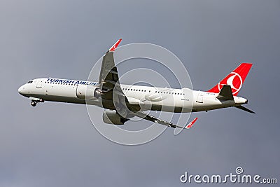 Closeup of a Turkish Airlines airplane against a gray sky background Editorial Stock Photo