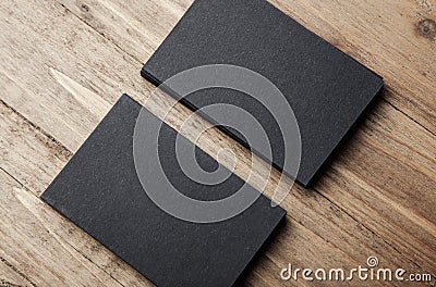 Closeup of two stack Of blank black business cards on wooden background Stock Photo