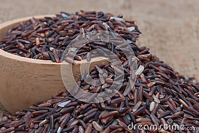 Closeup uncooked brown rice (Riceberry) Stock Photo