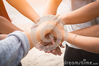 Closeup United hands on the sea background. Friendship, Teamwork Stock Photo