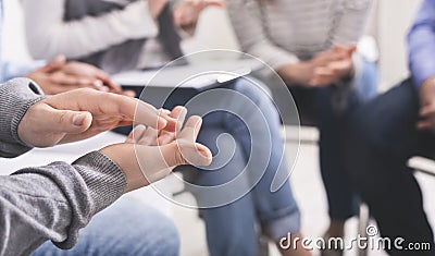 Closeup of unrecognizable male hands applauding at group therapy session Stock Photo