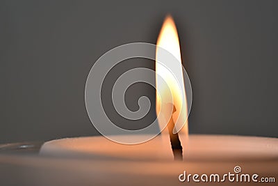 Closeup up of top of pillar candle and burning flame Stock Photo