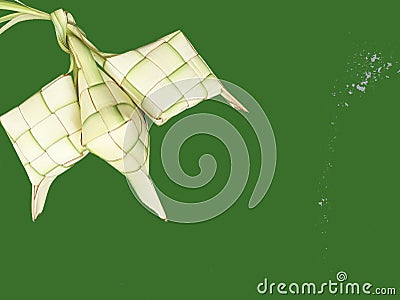 Closeup up white ketupat ramadan on light green background. Ketupat frame of Idul Fitri traditional. Eid mubarak theme. Stock Photo