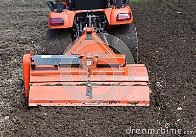 Closeup of Utility Tractor's Tiller Attachment Stock Photo