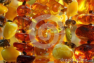 Closeup various baltic amber necklaces background texture outdoor Stock Photo