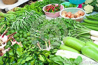 Closeup various types of fresh vegetables display in outdoor shop at morning flea market Stock Photo