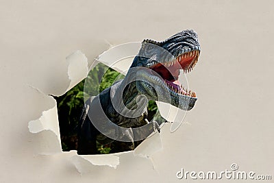 Closeup view of an angry T-Rex dinosaur figurine on black background Stock Photo