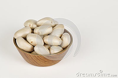 Bowl of Jackfruit seeds on white Stock Photo