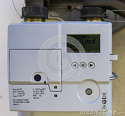 A closeup view of the dial or face of a metric gas meter Stock Photo