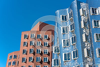 Closeup view of Frank Gehry`s famous modern buildings at Neuer Zollhof in Dusseldorf. Editorial Stock Photo
