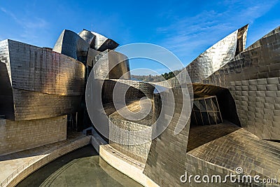 A closeup view of Guggenheim Museum\'s modern facade in Bilbao Spain Editorial Stock Photo