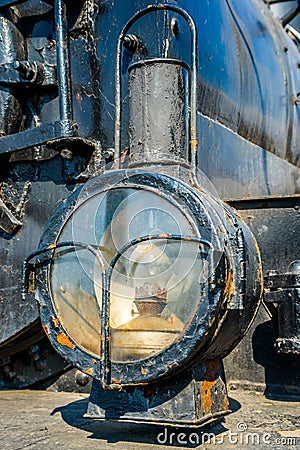 Closeup view of a headlight of the ancient steam locomotive. Pet Stock Photo