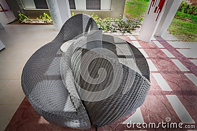 Closeup view of outdoor patio woven comfortable couch, love seat Stock Photo