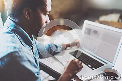 Closeup view of pensive African man working on laptop while spending time at home.Concept young business people using Stock Photo