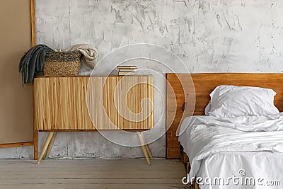 Closeup view on spacious airy eco style light loft bedroom with a bed and commode Stock Photo