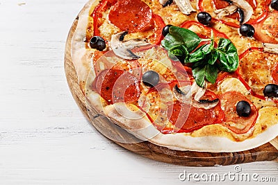 CLOSEUP view VERY HOT Italian Pizza. Prosciutto, Capricciosa, Funghi, Cotto HOMEMADE PIZZA. PIZZA ITALIAN, HOMEMADE PIZZA, PIZZA, Stock Photo