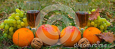 Closeup vine glass among heap of orange and fruits Stock Photo