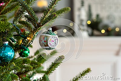 Closeup of a vintage Christmas ornament on a live tree Stock Photo