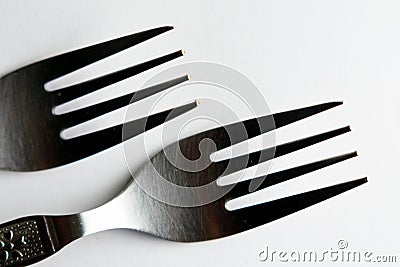 Closeup of vintage engraved silverware forks isolated on a white background Stock Photo