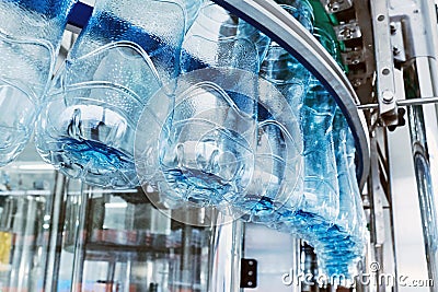 Closeup Water bottling line for processing mineral water Stock Photo