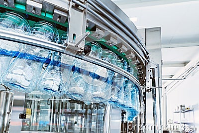 Closeup Water bottling line for processing mineral water Stock Photo