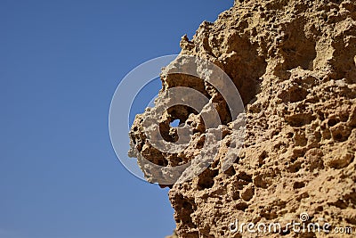 Closeup of the weathering of the globigerina limestone under the sunlight and a blue sky in malta Stock Photo