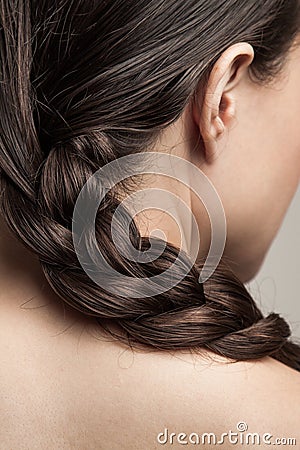 Closeup of wet woman hair in braid studio shot rear view focus on hair Stock Photo