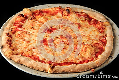 closeup whole sliced four cheese pizza on black background Stock Photo