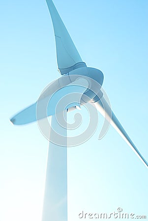 Closeup wind turbines, wind power blue sky background, design architecture, Mobile phone wallpaper, vertical Stock Photo