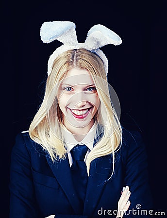 Closeup of winking bunny girl face. Blonde woman in rabbit bunny ears. Sweet lovely attractive adorable charming Stock Photo