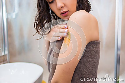 Closeup of woman applies on the body, hands scrub, mask, lotion Stock Photo