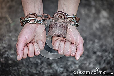 Closeup woman with chained hands and padlock Stock Photo