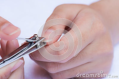 Closeup of a woman cutting nails Stock Photo