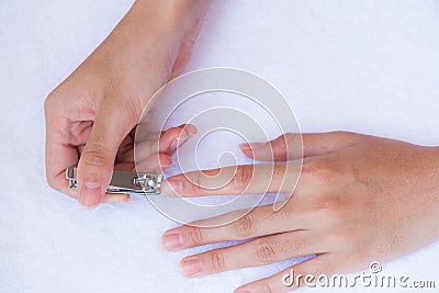 Closeup of a woman cutting nails Stock Photo