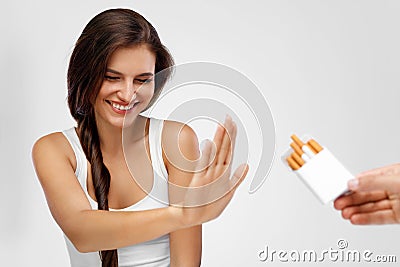 Closeup Of Woman Giving Up Smoking Cigarettes. Health Concept Stock Photo