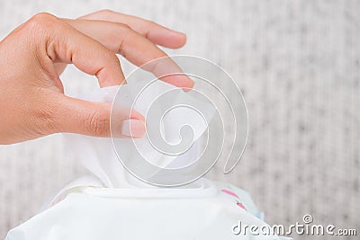 Closeup woman hand holding wet wipes from package. healthcare, p Stock Photo