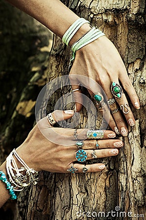 Closeup of woman hand on tree surface in heart shape with lot o Stock Photo