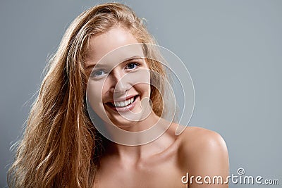 Closeup of woman playfully winking at camera Stock Photo