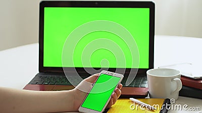Closeup woman sitting table notebook female hands keyboarding laptop using texting pointing networking green screen. Chroma key chromakey keyboard white device stock video Closeup woman sitting table notebook female hands keyboarding laptop using texting pointing networking green screen. Chroma key chromakey keyboard white device stock video