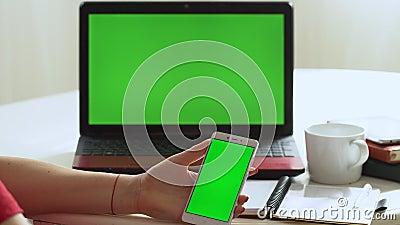 Closeup woman sitting table notebook female hands keyboarding laptop using texting pointing networking green screen. Chroma key chromakey keyboard white device stock footage Closeup woman sitting table notebook female hands keyboarding laptop using texting pointing networking green screen. Chroma key chromakey keyboard white device stock footage