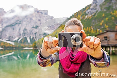 Closeup on woman taking photo on lake braies Stock Photo