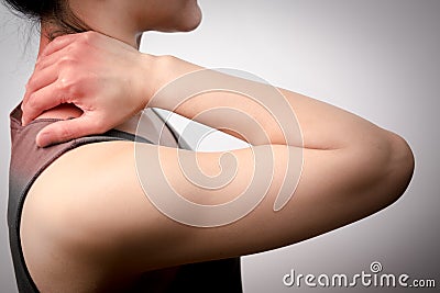 Closeup women neck and shoulder pain/injury with red highlights on pain area with white background, healthcare and medical concept Stock Photo