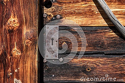 Closeup of a wooden door of a typical Alpine hut, Dolomite Alps in South Tirol Stock Photo