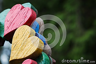 Closeup of wooden two hearts on bench in outdoor Stock Photo