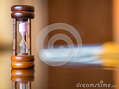 Closeup wooden hourglass on the table, Stock Photo