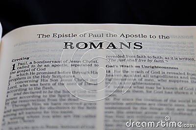 Closeup of "The epistle of Paul the Apostle to the Romans" in Holy Bible Stock Photo