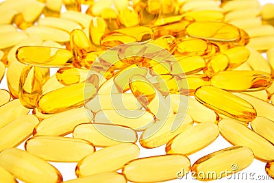 Closeup of yellow capsules Stock Photo