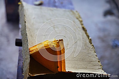 Closeup of yellow triangular layers of paper in the final stages of drying. Stock Photo