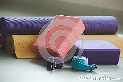 Closeup of yoga blocks belts and mat props Stock Photo